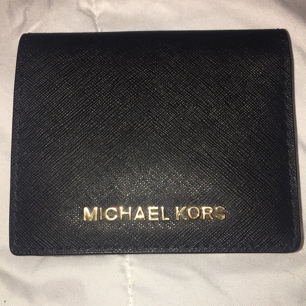 Michael Kors black wallet.